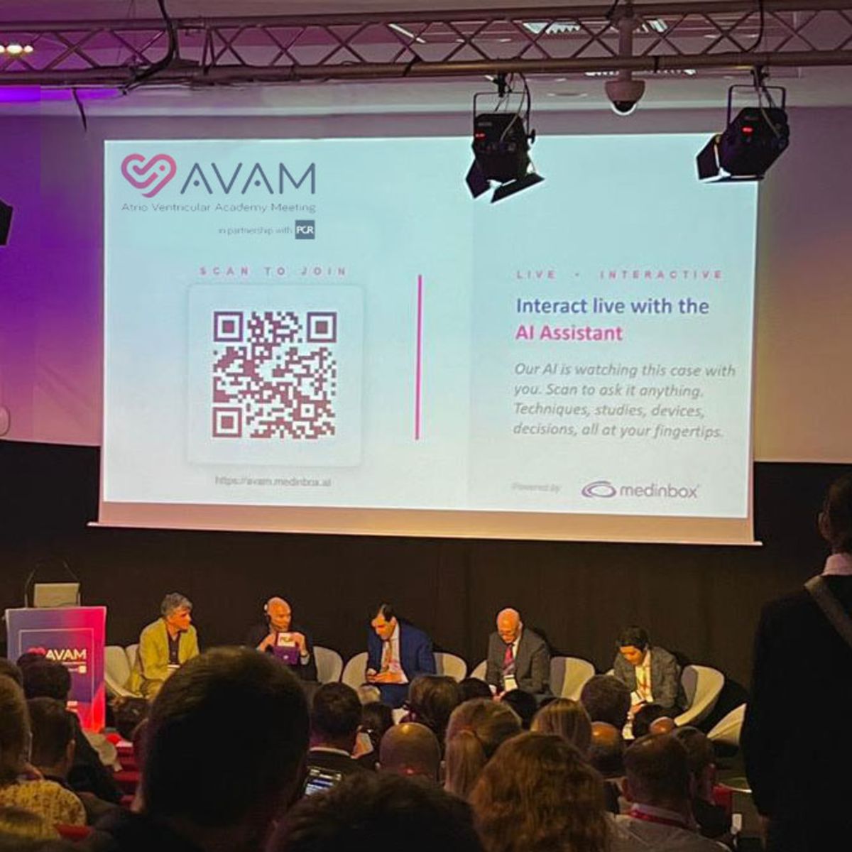 AVAM Symposium 2026 — live AI Live Case in the auditorium